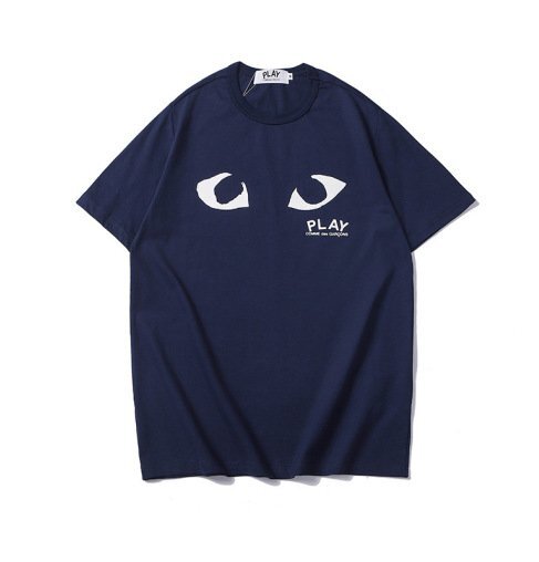 camiseta comme des garcons con ojos azules marinos